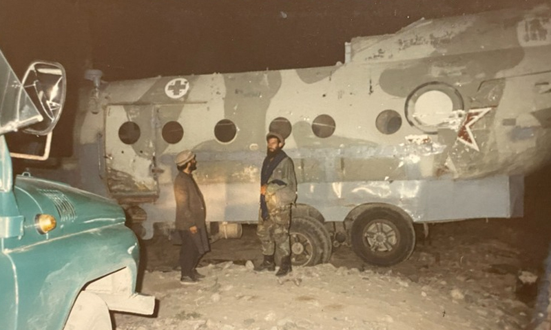 Afghan Mujahideens standing next to a truck with an attached body from a downed Russian Helicopter in Afghanistan picture by Khush Ahmad ul Mulk circa 1989