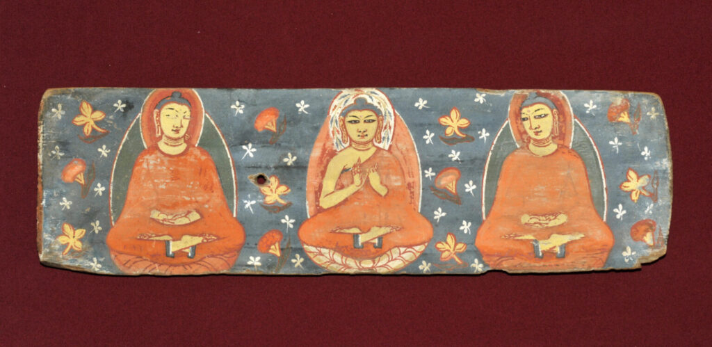 Three Buddhas painted on the inside of the bottom of a pair of Gilgit manuscript preserved in Shri Pratap Singh Museum Srinagar Picture by R Linroth
